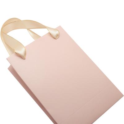 China Recyclable Pink Paper Bag With Ribbon High Quality Custom Bag for sale