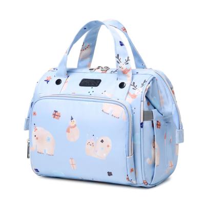 China New Design Water Resistant Small Cartoon Print Baby Multifunctional Wet Diaper Backpack Diaper Bags For Mommy Travel for sale