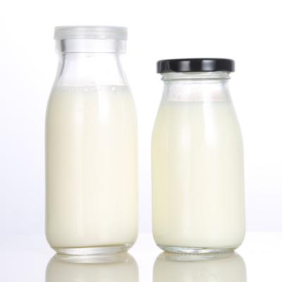 China Wholesale 100ml 200ml 250ml 500ml Empty Clear Round Milk Bottles Milk Glass Juice Bottle for sale