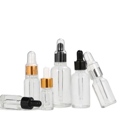 China Personal Care Cosmetic Bottle Empty Frosted Glass Clear Essential Oil Dropper Bottles With Outer Cover Dropper for sale