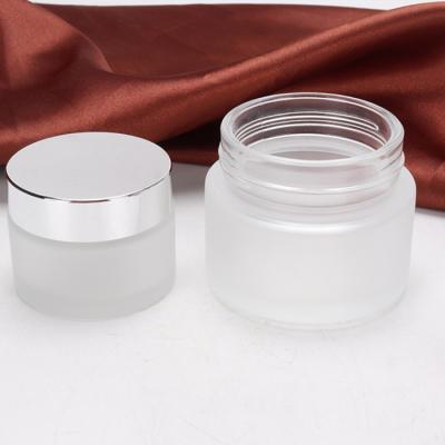 China Personal care frosted 5g 10g 15g 20g 30g 50g 80g 100g glass cream jar cosmetic jar with silver cap for sale