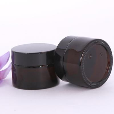 China Personal Care Wholesale 30g Amber Glass Cosmetic Cream Jar With Black Screw Cap for sale