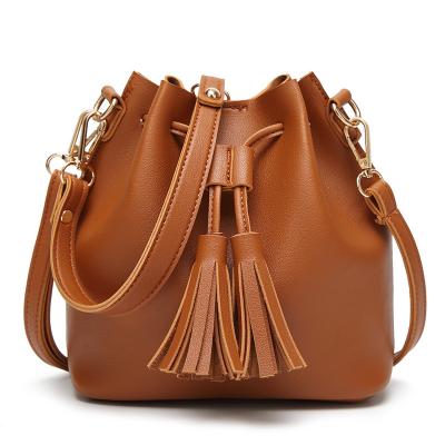 China Fashion Waterproof Color Price Tote Bag Ladies Portable Bucket Promotional Bag With Tassel Shoulder Bag Soft PU Leather Women Handbag for sale