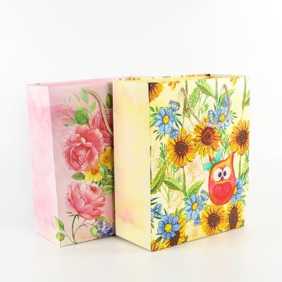 China Gift & Large Gift Packing Paper Craft Portable Shopping Place Creative Thickened Bottom Paper Bag for sale