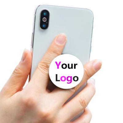 China Free Sample Printed Logo Collapsible Grip Stand Phone Grip Sublimation Blank Adjustable Folded Phone Holder Stand Socket Phone Holder for sale