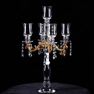 China Unique Art Modern Glass Ware Wholesale 5 Arms Gold Candelabra Metal Weddings Decoration Crystal Centerpieces With Hanging Crystals for sale