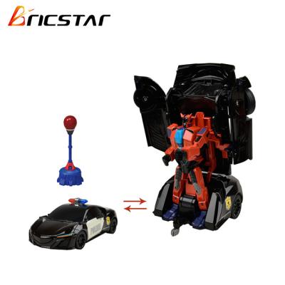 China Toy Bricstar battery operated intelligent rc deformation robot car, robot boxing battle toy with punching bag for sale