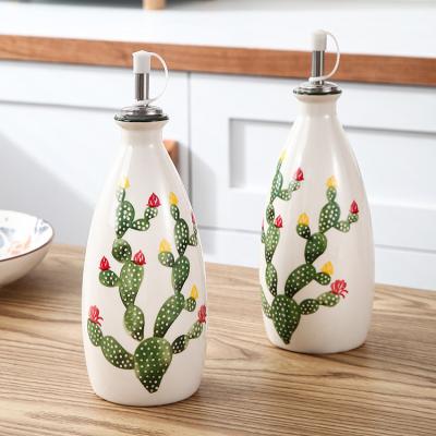 China Stocked Farmhouse Kitchen Dressing Dispenser with Spouts Cactus Decal Ceramic Dressing Bottle Pour Set of 2 for sale