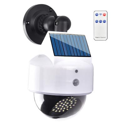 China Garden Solar LED Light Outdoor Waterproof Motion Sensor Solar Wall Light Wireless Simulation Monitoring Street Light For Garden Garage for sale