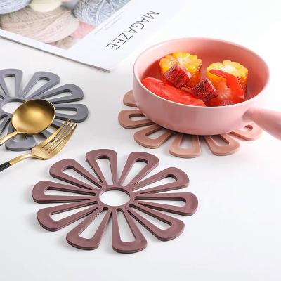 China 2022 New Kitchen Flower Silica Gel Drain Dish Thick Viable Mat Silicone Coaster Hollow Cups for sale