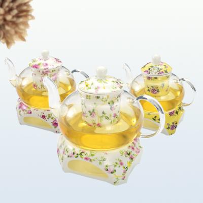 China Sustainable Glass Drinking Teapot With Ceramic Wax Warmer Flower Teapot Set for sale