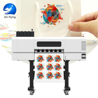 China UV with varnish UV DTF printer with free software for printing Bottle pen phone case en venta