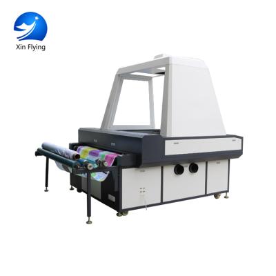 中国 paper laser cutting machine price vinyl sticker laser cutting machine roll to roll laser cutting machine 販売のため