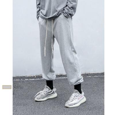 China 2022 breathable men's autumn and men's nine-point pants new cotton solid color winter pants sports casual pure loose sweatpants pants for sale