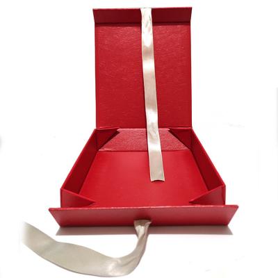 China Recyclable Cosmetic Rigid Folding Magnetic Collapsible Cardboard Gift Paper Packaging Box With Ribbon Closure Making for sale