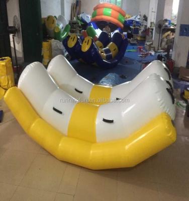 China 0.9mm PVC Tarpaulin New Design Inflatable Water Floating Seesaw For Sale for sale