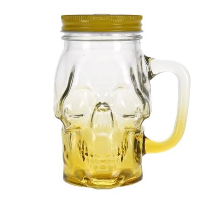 China Food Clear With Yellow Beverage Jar With Screw Lid Square Type With Spray Yellow Color And Skull Embossment 480ml Glass Jar for sale