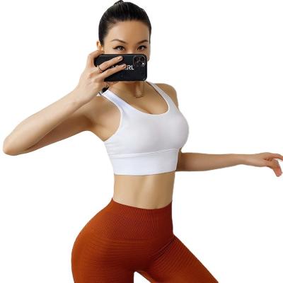 China Breathable Women Plus Size Yoga Bra Quick Dry Sports Invest Sexy Girls Running Fitness Crop Tops White Shock Proof Sports Bras For Women for sale