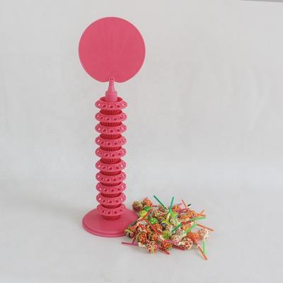 China Eco-friendly Logo Customized Table Top Multi Layers Plastic Pacifier Lollipops Display Stand Holders for sale