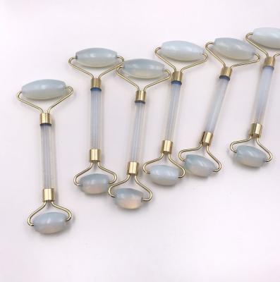 China New Style Face Roller Jade Roller Gem Stone Hand Held Opal Stone Massager Anti Aging Face Roller for sale