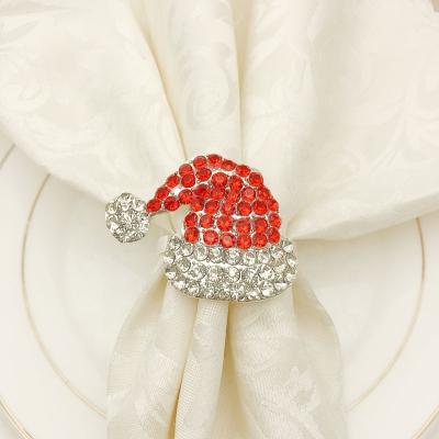 China Hotel Viable Christmas Crystal Hat Napkin Rings Christmas Napkin Buckle Red Christmas Banquet Napkin Circle Decoration HWC81 for sale