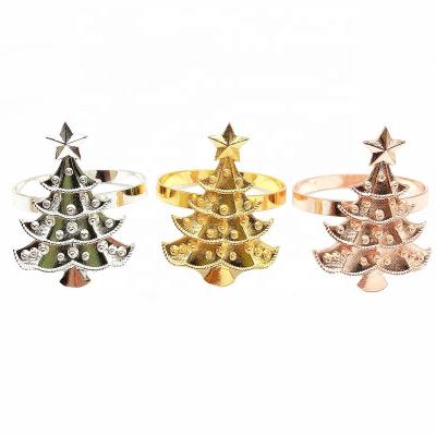 China Luxury Sustainable Christmas Napkin Rings Gold Christmas Tree Napkin Ring Holder Wedding Metal Napkin Buckle For Christmas HWC53 for sale