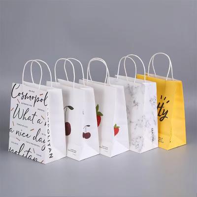 China Recycled Materials Recyclable White Printed Paper Bags With Handles Custom Shopping Gift Wrap Paper Bags With Your Own Logo for sale