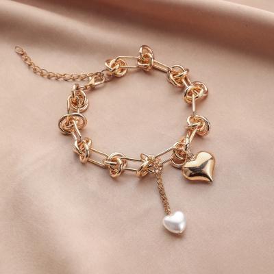 China New Hiphop Fashion Hip Hop Chunky Gold Plated Knot Chain Link Bracelets With Pearl Heart Charms for sale