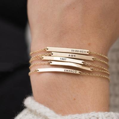 China FASHIONABLE Chunna Customized Engrave Simple Bar Bracelet 316L Stainless Steel Gold Color Letter Cut Out Women Charm Bracelets Jewelry for sale