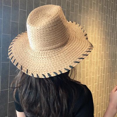 China Eco-friendly Raw Material Korean Women Round Raffia Wide Straw Hats Summer Sun Beach Panama Hat Men Cap Paper Flat Brim Cowboy for sale