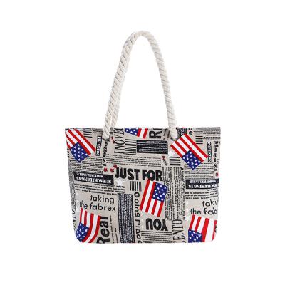 China 2021 high quality fashionable cross printed eco-friendly USA newspaper travel handbag beach bag for women for sale