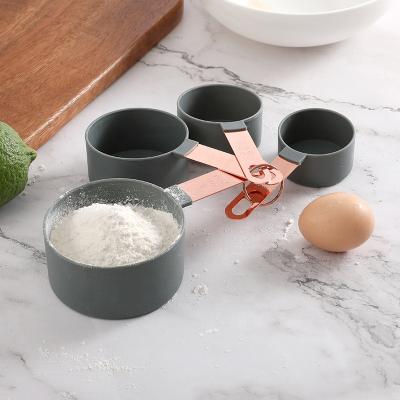 China Viable in Stock Hot Sale Plastic Nested 8pcs Measuring Cups and Spoons Set with Copper Handle Rose Gold Handle Cooking Tools for sale