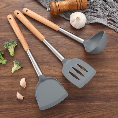 China Viable in Stock Wholesale Silicone Utensil Set with Beech Wood Handle Pocket Slotted Turner Turner Silicone Kitchenware for sale