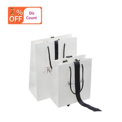 China Free Sample Hot Selling Custom Luxury White Paper Bag Recyclable With Gift Ribbon for sale