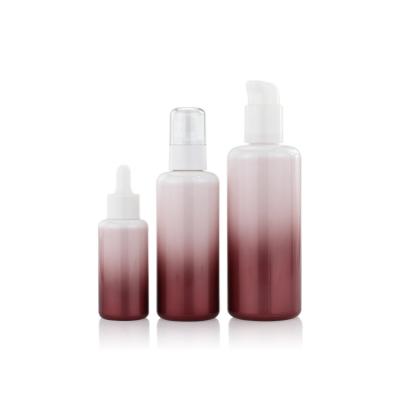 China Empty Round Gradient Lotion Serum Glass Bottle Set 30ml 50ml 100ml for sale