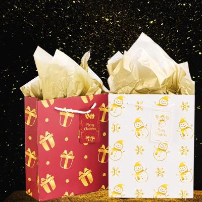 China Recycled Materials Premium Xmas Wrapping Multi-purpose Christmas Assorted Gold Foil Logo Gift Favour Paper Bags For Boxing Day New Year Party for sale