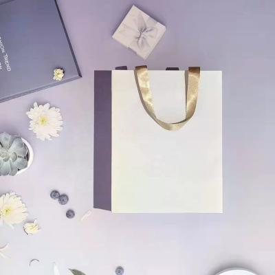 China Recyclable Wholesale Cheap Small Luxury Paperbag Fancy Favor Wedding Door Gift White Shopping Paper Bags With Ribbon Handles for sale