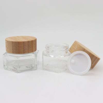 China Hot Sale Wholesale Clear Empty Cosmetic Bottle 20g Hexagonal Shape Glass Eye Cream Cosmetic Bottles With Bamboo Lids for sale