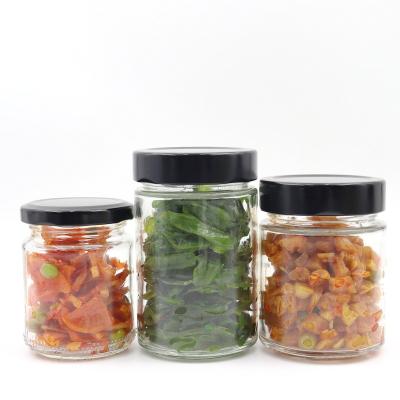 China Wholesale 200ml 300ml Food Round Clear Glass Spice Food Storage Jar Glass Pickle Jar With Black Deep Lids for sale