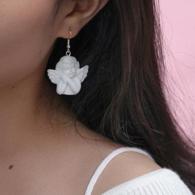 China Hot Sale Fashionable Style Popular Baroque Vintage Cute Angel Cupid Pendant Women Resin White Earrings Small for sale