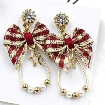 China Fashionable Beautiful Bow Star Christmas Elegant Style Simple Design Pearl Bead Women Dangle Earrings for sale