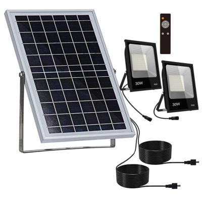 China 2022 New Design Outdoor/Indoor Outdoor Solar Flood Light System 2 Flood Lights with 1 Solar Panel for sale