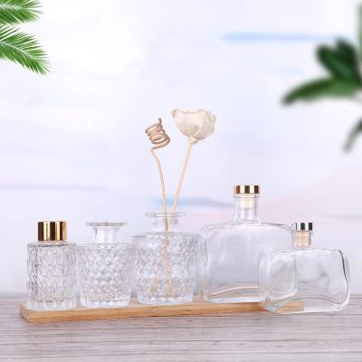 China 200ml Matte Black Empty Reed Diffuser Glass Cosmetic Pineapple Shaped Bottle With Wooden Lid for sale