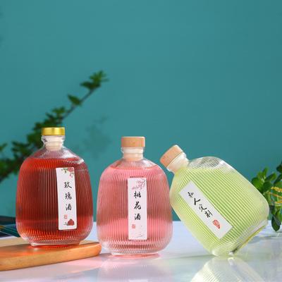 China Unique Beverage Design 100ml Rectangle Glass Bottle For Vodka Brandy Whiskey for sale