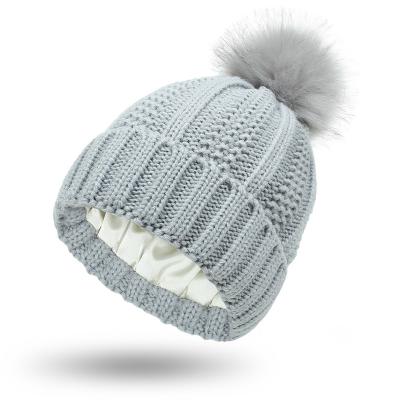 China COMMON Custom Satin Knitted Pompom Hat For Women for sale