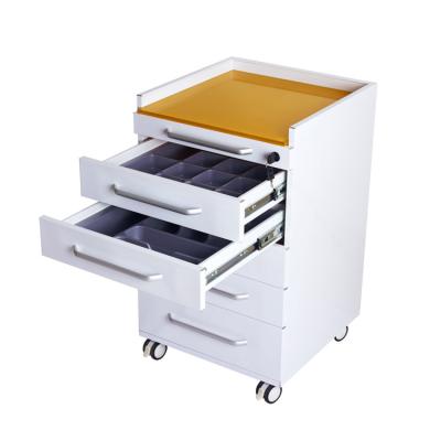 China Stainless Steel Body Tempered Glass Table with 5 Drawers Dental Clinic Cabinet for sale