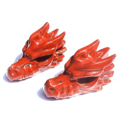 China Natural Red Crystal Stone Dragon Head Europe Hand Carvings Jasper Crystal Craft for sale