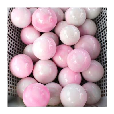 China Europe Polished Natural Stone Heated Aragonite Sphere Ball For Home Decoration for sale