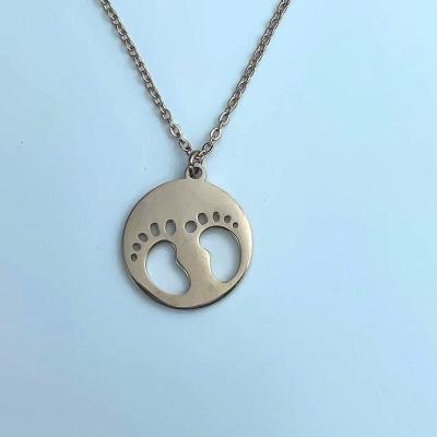 China Hypoallergenic Baby Footprints Love Necklace Stainless Steel For Mom Cute Crystal Hollow Footprint Charm Pendant With Birthstone Gifts for sale