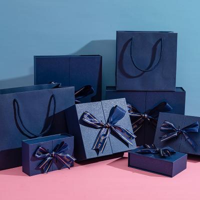 China Dark Blue Recycled Materials Gift Box Paper Gift Packing Double Open Box Packaging With Bowknot Accept Customized for sale